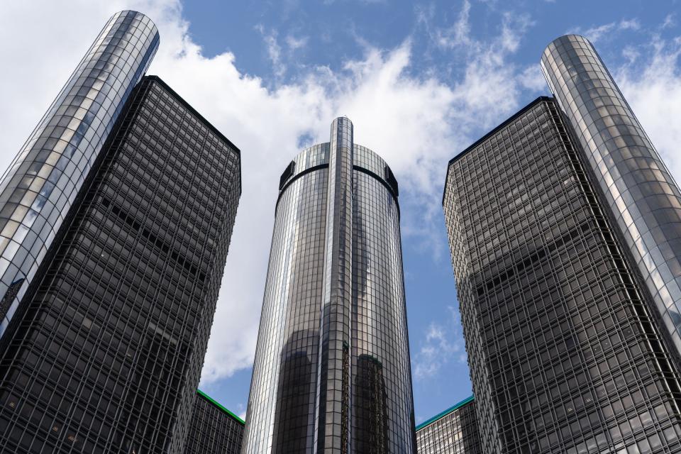 The Renaissance Center in downtown Detroit sits in the background along the Detroit RiverWalk on March 11, 2021.