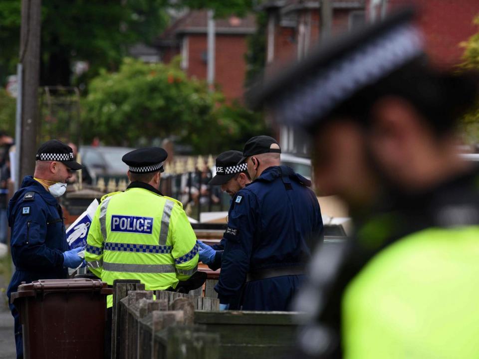 Police officers arrive at a residential property on Elsmore Road in Fallowfield, Manchester, on May 24, 2017, (AFP/Getty Images)