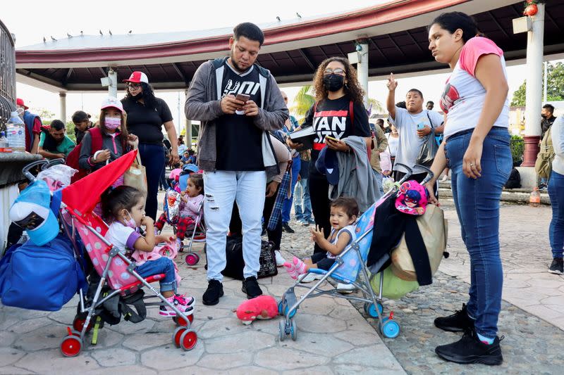 Migrants walk in a caravan headed to the Mexican capital to apply for asylum and refugee status