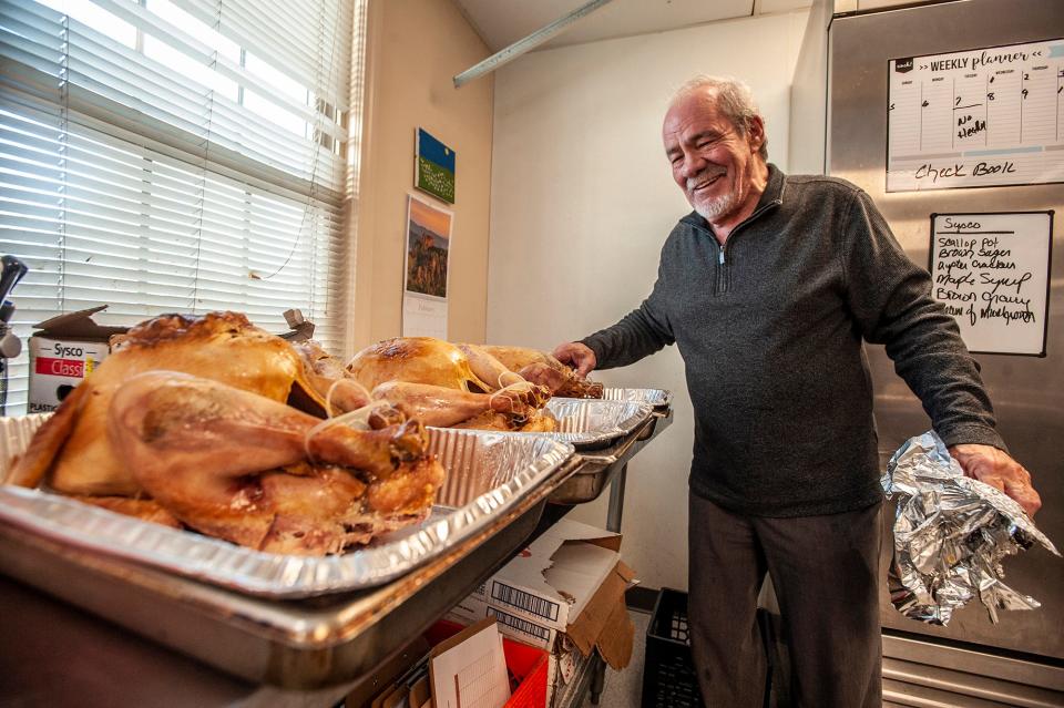 Mark Curtis is shown in the Pearl Street Cupboard Food Pantry kitchen with some of 120 turkeys he cooked for the 35th annual Curtis Family Thanksgiving Dinner.