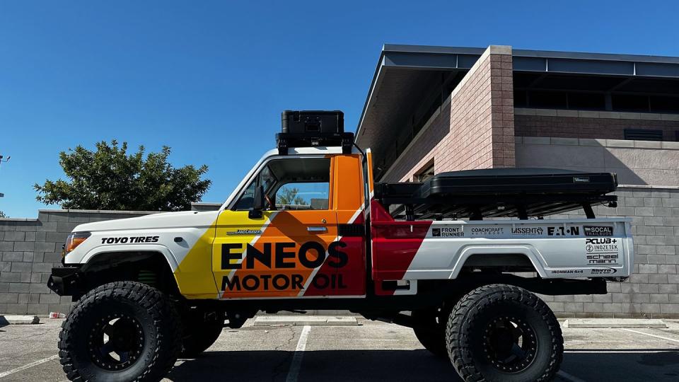 eneos land cruiser pickup parked outside a building