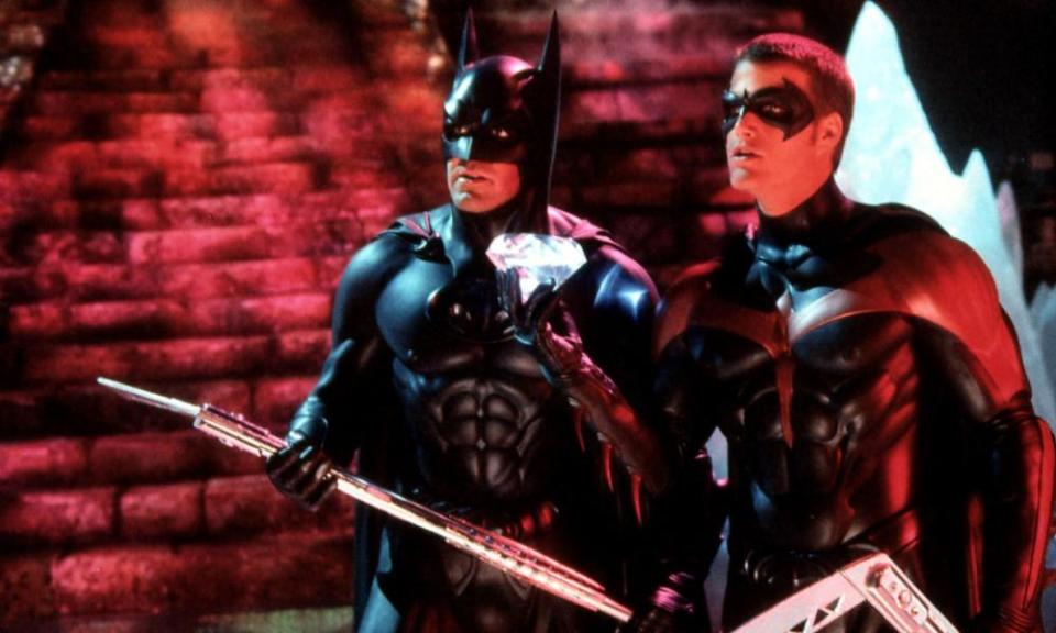 Batman holding a spear next to Robin, both in masks