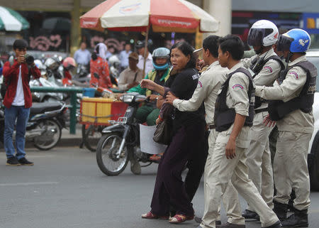 Protesters are pushed back by district authorities as they demonstrate in support of land rights activist Tep Vanny during her verdict in front of the Phnom Penh Municipal Court in central Phnom Penh, Cambodia, February 23, 2017. REUTERS/Samrang Pring