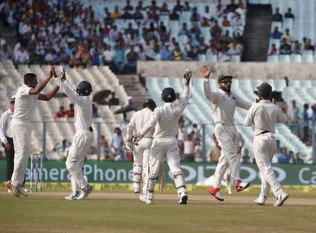 Cricket - India v New Zealand - Second Test cricket match - Eden Gardens, Kolkata, India - 03/10/2016. India's players celebrate the dismissal of New Zealand's Tom Latham. REUTERS/Rupak De Chowdhuri