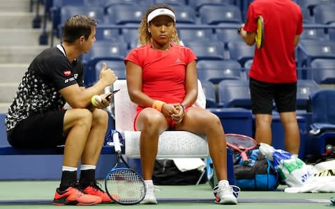 Naomi Osaka, of Japan, takes a break while practicing before playing Serena Williams in the finals of the U.S. Open tennis tournament, Saturday, Sept. 8, 2018, in New York - Credit: AP