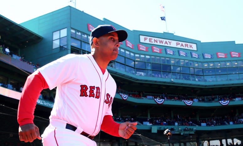 Alex Cora running onto the field.