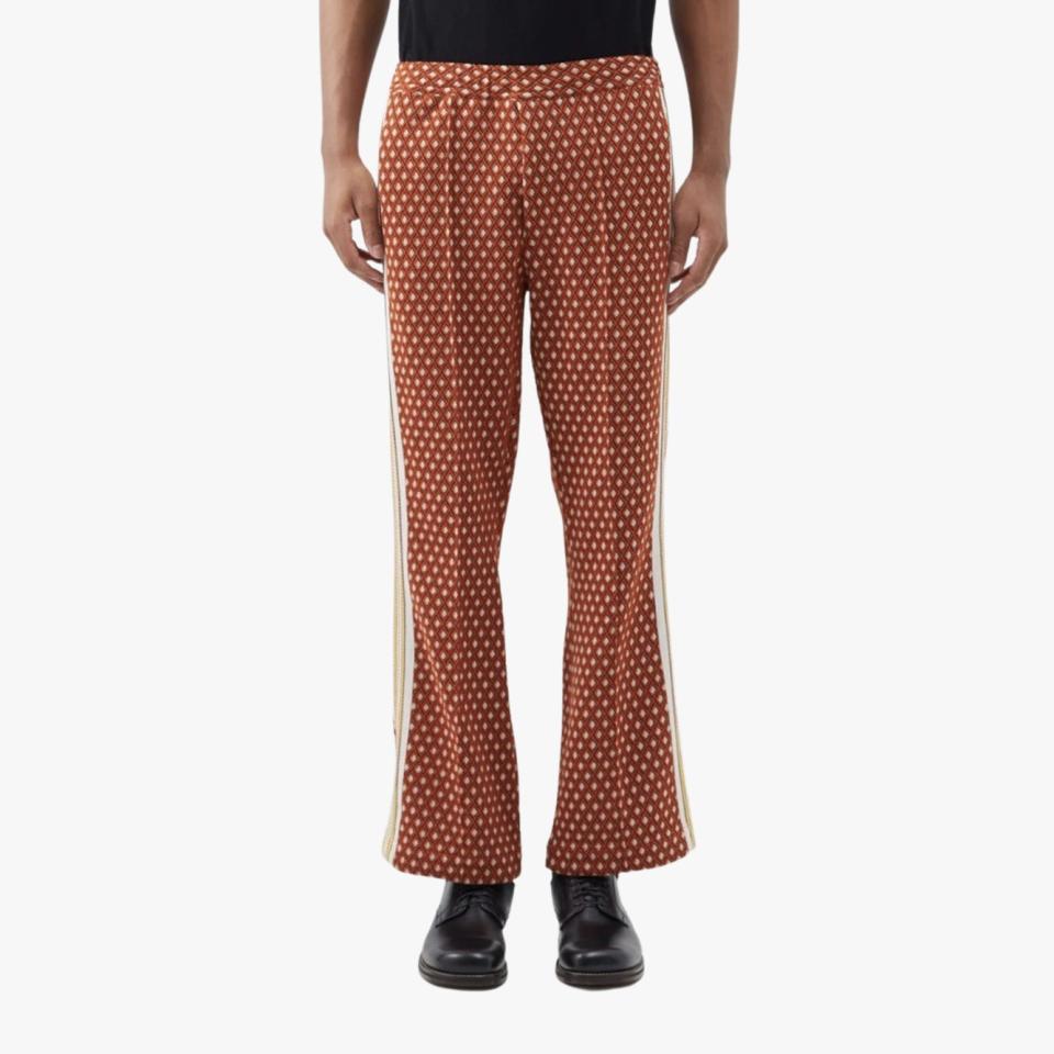$260, MATCHES. <a href="https://www.matchesfashion.com/us/products/Sasquatchfabrix.-Geometric-jacquard-bootcut-track-pants-1519492" rel="nofollow noopener" target="_blank" data-ylk="slk:Get it now!;elm:context_link;itc:0" class="link ">Get it now!</a>