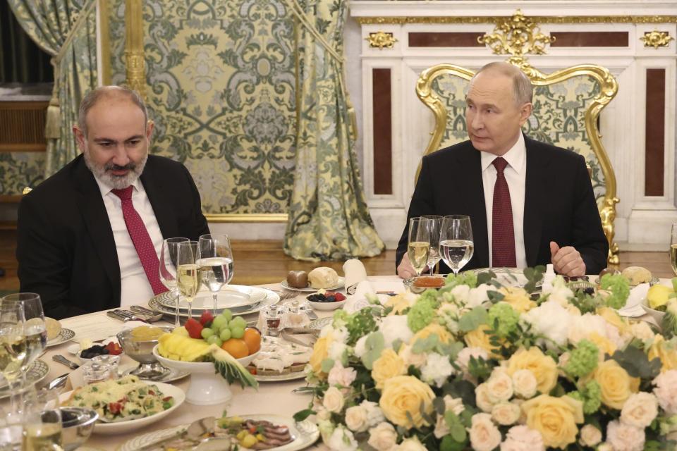 Armenian Prime Minister Nikol Pashinyan, left, and Russian President Vladimir Putin attend a working dinner following a meeting of the Eurasian Economic Union at the Kremlin in Moscow, Russia, on Wednesday, May 8, 2024. Russian President Vladimir Putin hailed the economic alliance's performance, saying that it helped boost the members' economic potential. (Alexander Kazakov, Sputnik, Kremlin Pool Photo via AP)