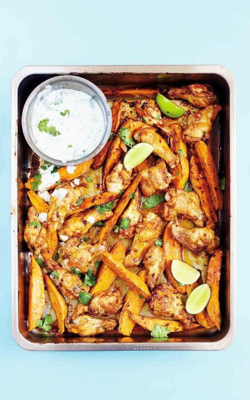 <p>David Loftus</p><p>A cilantro lime yogurt dip is the perfect thing to cool down spicy chipotle chicken wings and sweet potato fries.</p><p><strong>Get the recipe: <a href="/653399/parade/spicy-chipotle-chicken-wings-with-sweet-potato-wedges-cilantro-lime-yogurt/" data-ylk="slk:Spicy Chipotle Chicken Wings with Cilantro Lime Yogurt Dip;elm:context_link;itc:0;sec:content-canvas" class="link rapid-noclick-resp">Spicy Chipotle Chicken Wings with Cilantro Lime Yogurt Dip</a></strong></p>