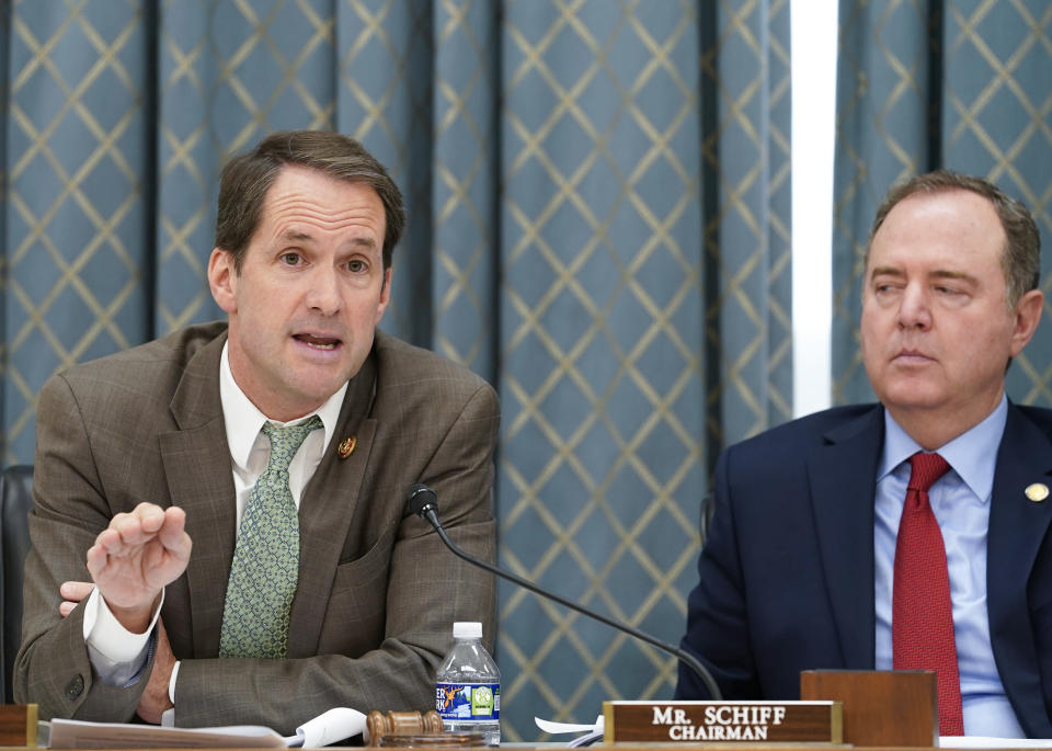 Chairman Adam Schiff, D-Calif., right, listens as Rep. Jim Himes, D-Conn., speaks during a House Intelligence Committee hearing on Commercial Cyber Surveillance, Wednesday, July 27, 2022, on Capitol Hill in Washington. (AP Photo/Mariam Zuhaib)