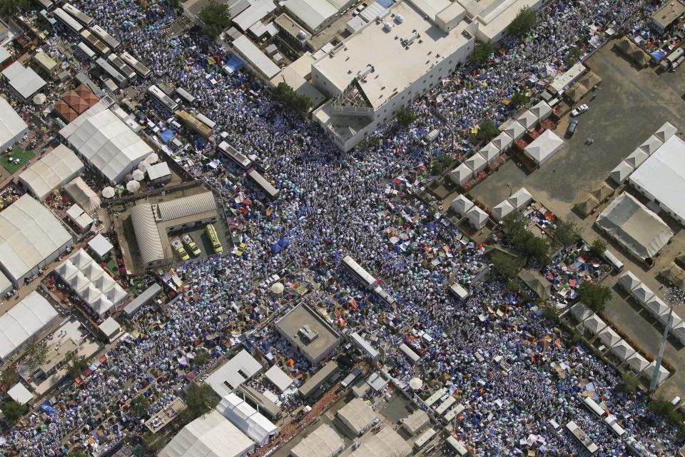 FILE - In this file photo taken Monday, Nov. 15, 2010, Muslim pilgrims pray in the streets of Arafat, near Mecca, Saudi Arabia. King Abdullah has ratified a new counter-terrorism law which went into effect Sunday, Feb. 2, 2014. Rights activists said that the law criminalizes speech critical of the government or society. It was published in full in the government's official gazette Um Al-Qura Friday. (AP Photo, File)