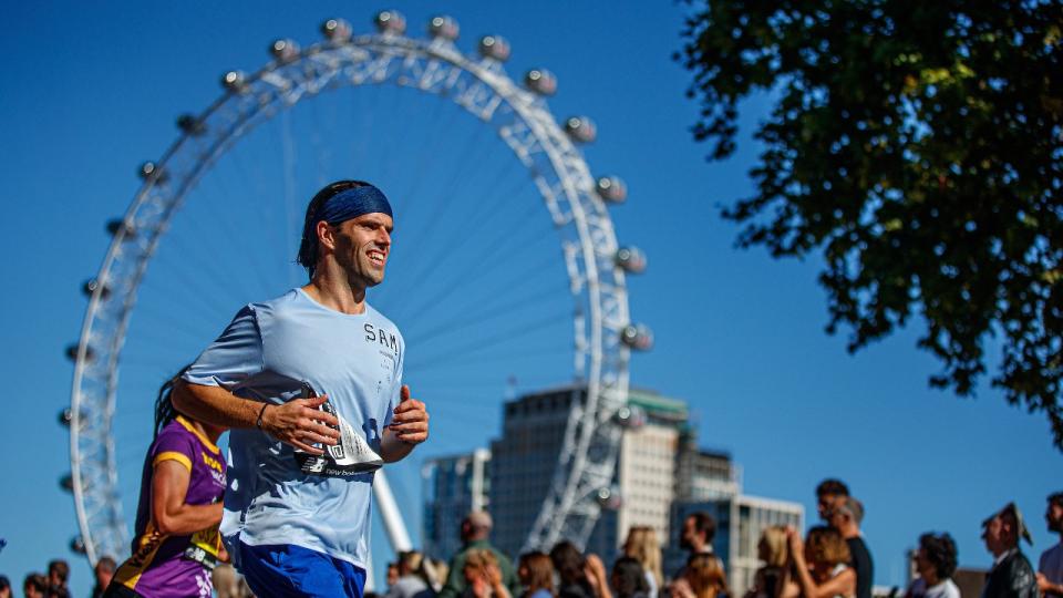 A view of The London Eye as runners pass through Parliament Square in The TCS London Marathon on Sunday 2nd October 2022.