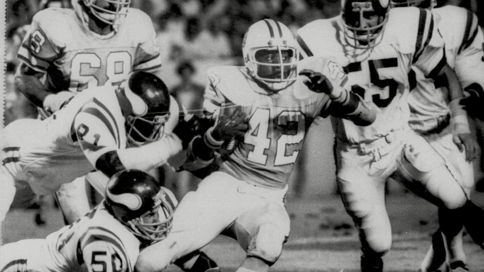 Mandatory Credit: Photo by AP/Shutterstock (6589508a)RICKY BELL Tampa Bay Bucs running back Rickey Bell makes a short yardage gain in the first quarter as he tries to escape the cluthces of a host of Minnesota defenders in game at Tampa, FlaBUCS VIKINGS, TAMPA, USA.