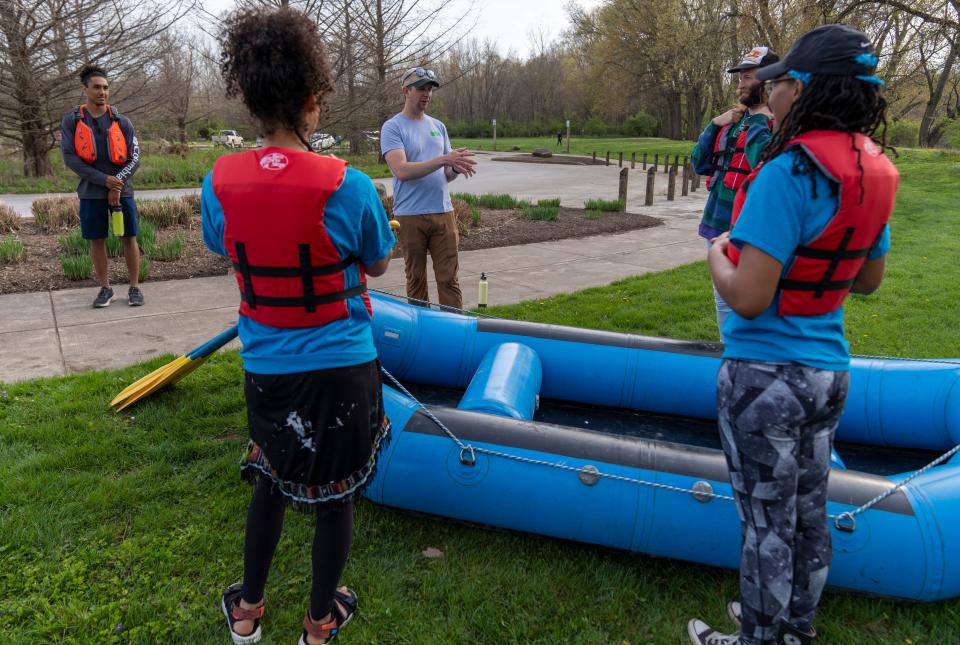 Scott Salmon (light shirt) gives instruction, Indianapolis, Saturday, April 23, 2022, along a stretch of the White River running between Carmel and northern Indianapolis. Friends of the White River’s Salmon is teaching the workshop for people who want to learn to guide others during future rafting trips.