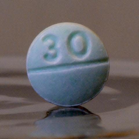 A drug ring prosecuted in federal court in Erie trafficked in blue fentanyl pills, like the one shown here, meant to mimic prescription pain pills.