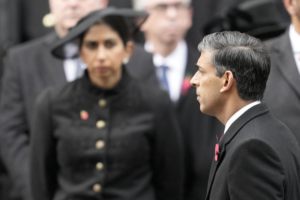 Britain's Prime Minister Rishi Sunak walks past Home Secretary Suella Braverman as they attend the Remembrance Sunday service at the Cenotaph on Whitehall in London, Sunday, Nov. 12, 2023. Every year, members of the British Royal family join politicians, veterans and members of the public to remember those who have died in combat. (AP Photo/Kin Cheung, Pool)