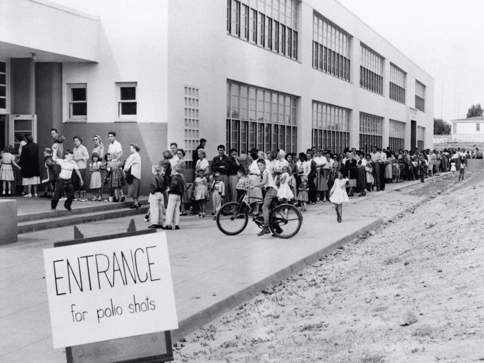 Once a vaccine was available, people lined up to protect themselves and their families from the virus. <a href="https://www.gettyimages.com/detail/news-photo/san-diego-california-first-and-second-graders-at-the-kit-news-photo/514704620" rel="nofollow noopener" target="_blank" data-ylk="slk:Bettmann via Getty Images;elm:context_link;itc:0;sec:content-canvas" class="link ">Bettmann via Getty Images</a>