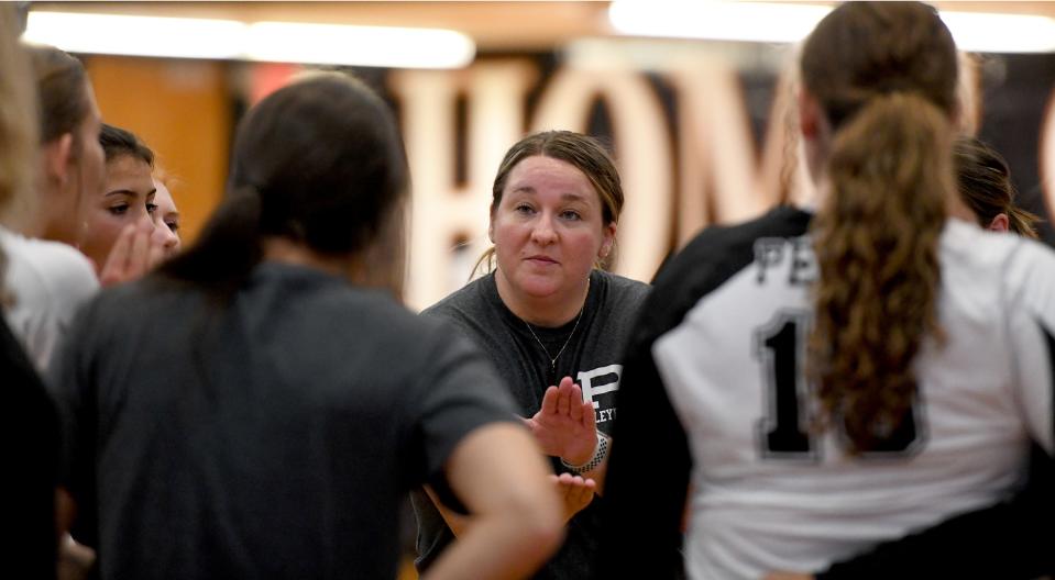 Perry head coach Sheena Stropki talks to her players during Tuesday's match against Green.