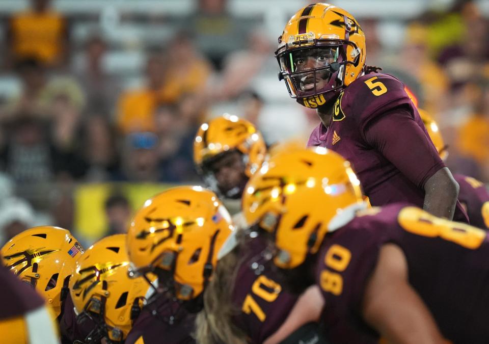 Sept. 1, 2022; Tempe, Arizona; Arizona State Sun Devil quarterback Emory Jones lines up to hike the ball against the Northern Arizona Lumberjacks at Sun Devil Stadium.