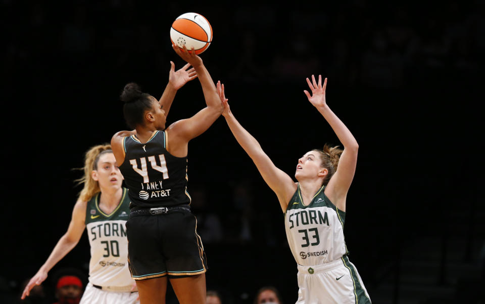 New York Liberty's Betnijah Laney (44) shoots over Seattle Storm's Katie Lou Samuelson (33) during the first half of a WNBA basketball game Friday, Aug. 20, 2021, in New York. (AP Photo/Noah K. Murray)