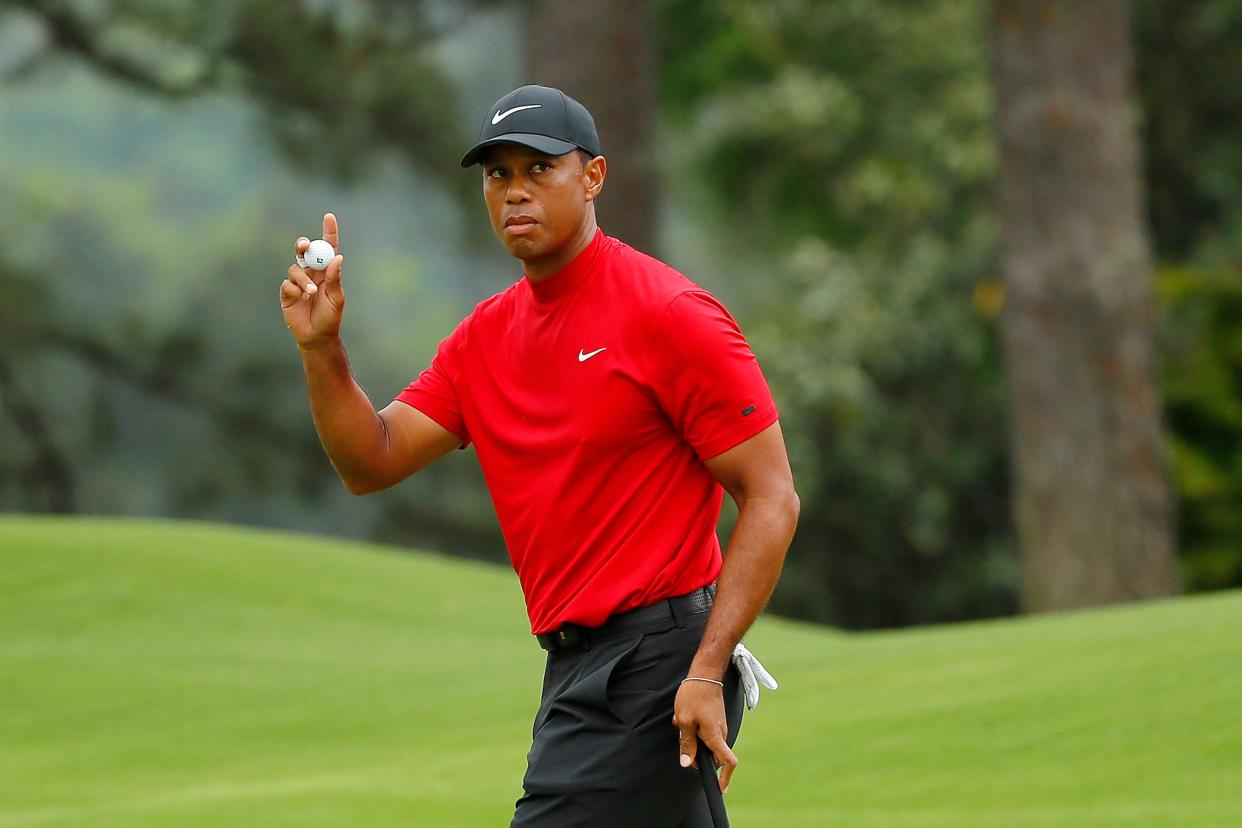 Tiger Woods waves to the crowd.