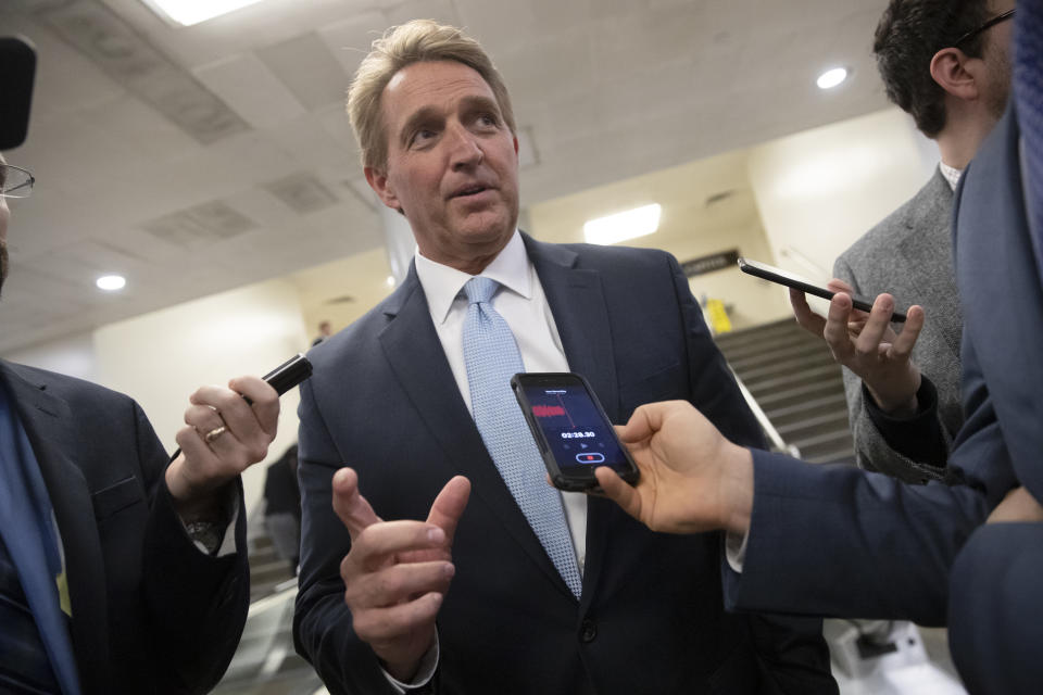 Sen. Jeff Flake, R-Ariz., speaks with reporters before he and Sen. Chris Coons, D-Del., try to bring up the legislation to protect special counsel Robert Mueller, at the Capitol in Washington, Wednesday, Nov. 14, 2018. Senate Republicans are facing renewed pressure to pass legislation to protect Mueller, with a handful of GOP senators urging their leadership to hold a vote now that President Donald Trump has pushed out Attorney General Jeff Sessions. (AP Photo/J. Scott Applewhite)