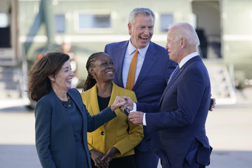 President Joe Biden speaks with New York Gov. Kathy Hochul, left, New York Mayor Bill de Blasio and his wife Chirlane McCray, center left, as he arrives at John F. Kennedy Airport for a two day visit to attend the United Nations General Assembly, Monday, Sept. 20, 2021, in New York. (AP Photo/Evan Vucci)
