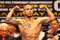 LAS VEGAS, NV - MAY 04: WBA super welterweight champion Miguel Cotto poses after weighing in at 154 pounds during the official weigh-in for his bout against Floyd Mayweather Jr. at the MGM Grand Garden Arena on May 4, 2012 in Las Vegas, Nevada. Cotto will defend his title against Mayweather on May 5, 2012 in Las Vegas. (Photo by Al Bello/Getty Images)