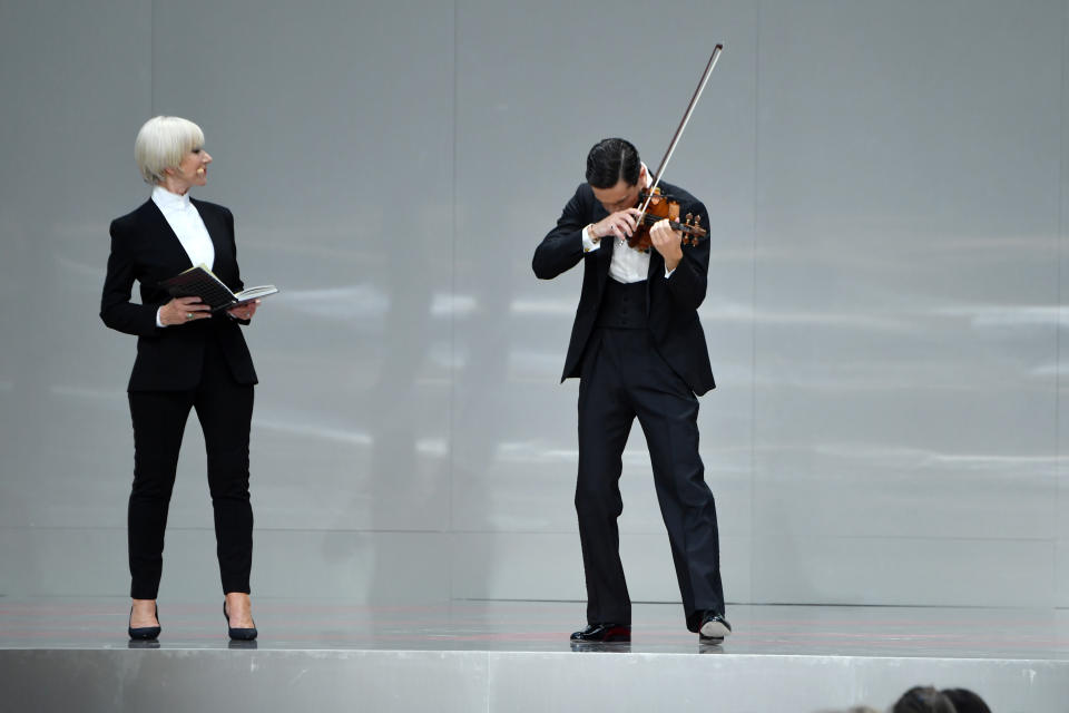 PARIS, FRANCE - JUNE 20: Helen Mirren and Charlie Siem are seen on stage during the Karl Lagerfeld Homage at Grand Palais on June 20, 2019 in Paris, France. (Photo by Pascal Le Segretain/Getty Images)