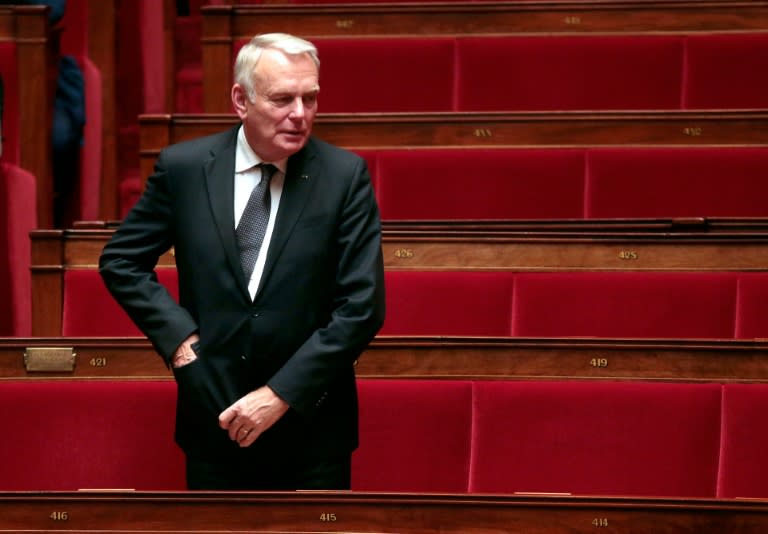 French Socialist member of Parliament and former Prime Minister Jean-Marc Ayrault stands after a session of questions to the Government at the National Assembly in Paris on November 4, 2015