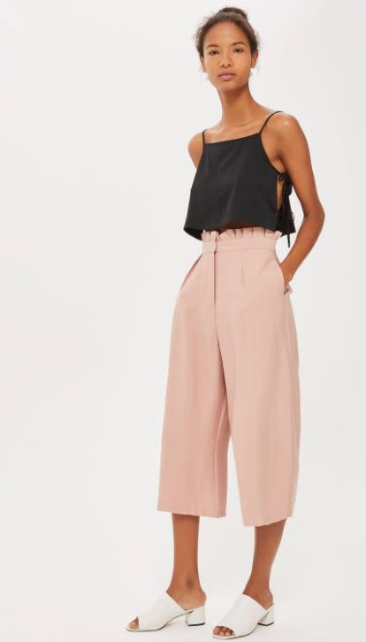 <a href="http://us.topshop.com/en/tsus/product/tall-paperbag-waist-crop-wide-leg-trousers-6790084?geoip=noredirect&amp;cmpid=ppc_pla_US_ip&amp;istCompanyId=da794a11-99cb-4206-8e52-61037452aeeb&amp;istItemId=xlatwwpwir&amp;istBid=tztx&amp;gclid=Cj0KCQjwub7NBRDJARIsAP7wlT9gwfDY2oHIEPaEeSjl_G_1kbsDlVVYtZWNN9nqYoF6PL1GdZbKFQIaAmBWEALw_wcB" target="_blank">Shop them here</a>.&nbsp;