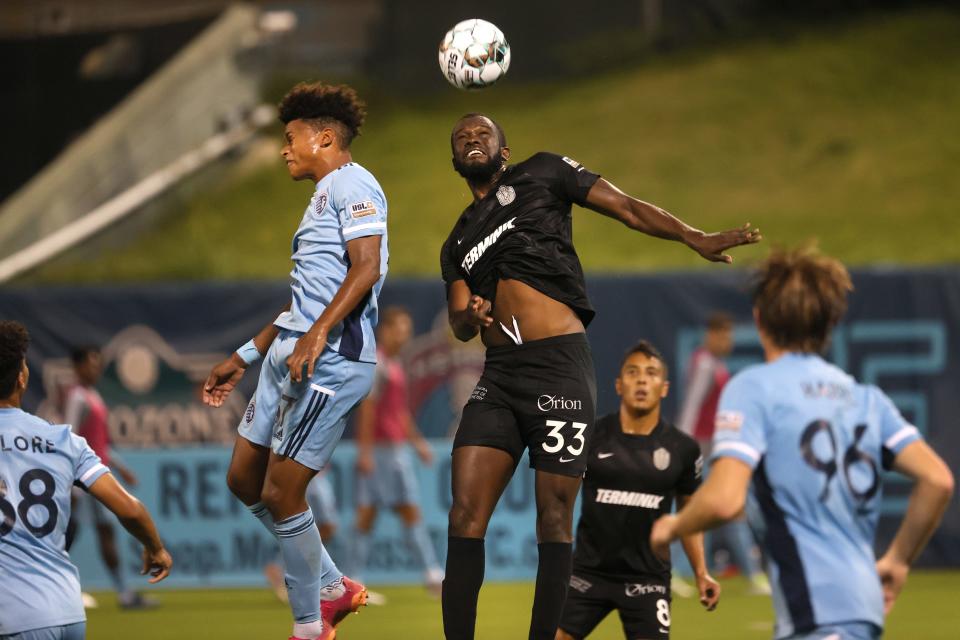 Memphis 901 FC's Skylar Thomas leaps up to head the ball against Sporting Kansas City II during their match at AutoZone Park on Wednesday, Oct. 6, 2021.