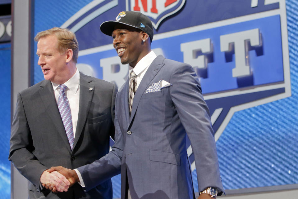USC wide receiver Marqise Lee, right is greeted by NFL commissioner Roger Goodell after being selected as the 39th pick by the Jacksonville Jaguars in the second round of the 2014 NFL Draft, Friday, May 9, 2014, in New York. (AP Photo/Jason DeCrow)