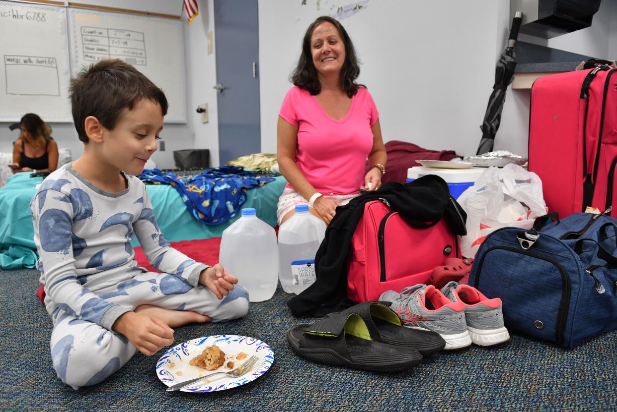 Mason Blumenthal, 6, is excited about spending the night at his school, Phillippi Shores Elementary, which was used as a storm shelter during Ian. His mom, Tara Blumenthal, and the rest of the family evacuated Tuesday as the hurricane approached Florida's west coast.