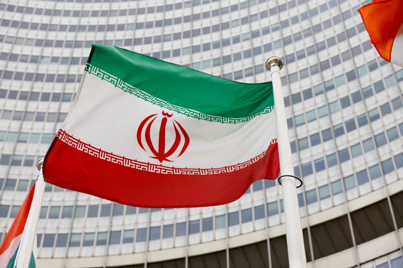 FILE PHOTO: The Iranian flag waves in front of the International Atomic Energy Agency (IAEA) headquarters in Vienna