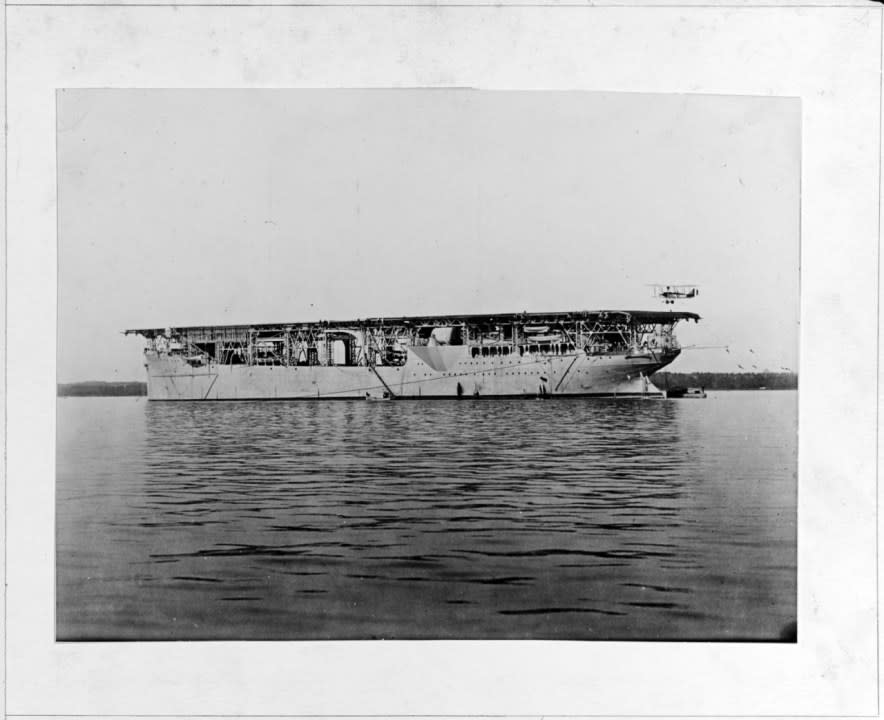 n the aftermath of World War I, the collier Jupiter was converted into the U.S. Navy’s first aircraft carrier, and recommissioned Langley (CV-1) on 20 March 1922. At anchor, with an Aeromarine 39-B airplane landing on her flight deck, circa 1922 (NHHC)