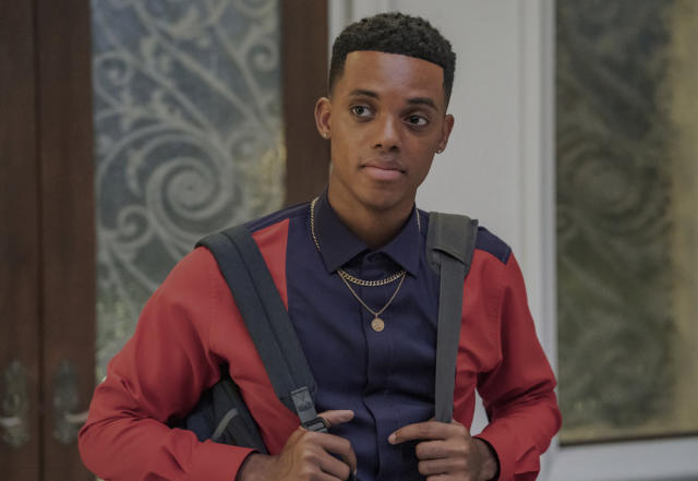 Jabari Banks as Will Smith in a red and purple Grayscale suit in ‘Bel-Air’ Episode 201 “A Fresh Start” (Ron Batzdorff/PEACOCK)