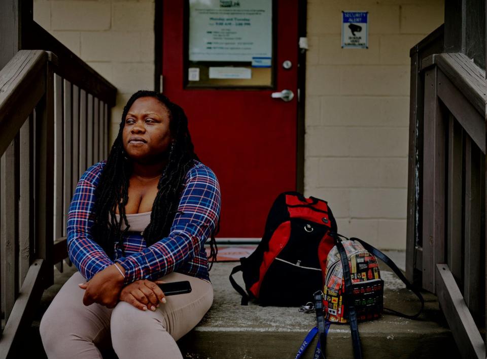 A woman sits outside the NeedLink Nashville offices after filling out an application to avoid losing electricity in 2022. <a href="https://www.gettyimages.com/detail/news-photo/melissa-besong-of-nashville-poses-for-a-portrait-outside-of-news-photo/1243291719" rel="nofollow noopener" target="_blank" data-ylk="slk:William DeShazer for The Washington Post via Getty Images;elm:context_link;itc:0;sec:content-canvas" class="link ">William DeShazer for The Washington Post via Getty Images</a>