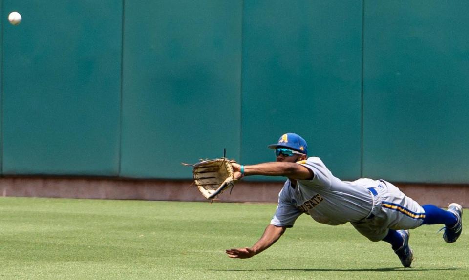Angelo State University's Koby Kelton stretches out to try to catch a fly ball against Southern New Hampshire in the Rams' opening game of the D-II College World Series in Cary, North Carolina on Sunday, June 5, 2022.