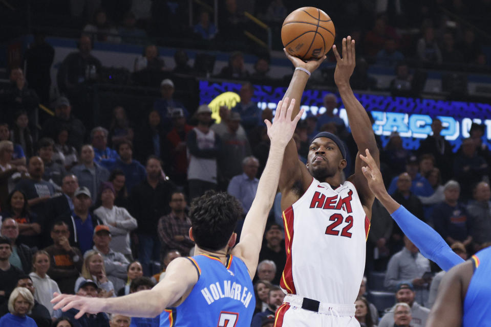 Miami Heat forward Jimmy Butler (22) prepares to shoot over Oklahoma City Thunder forward Chet Holmgren during the first half of an NBA basketball game Friday, March 8, 2024, in Oklahoma City. (AP Photo/Nate Billings)