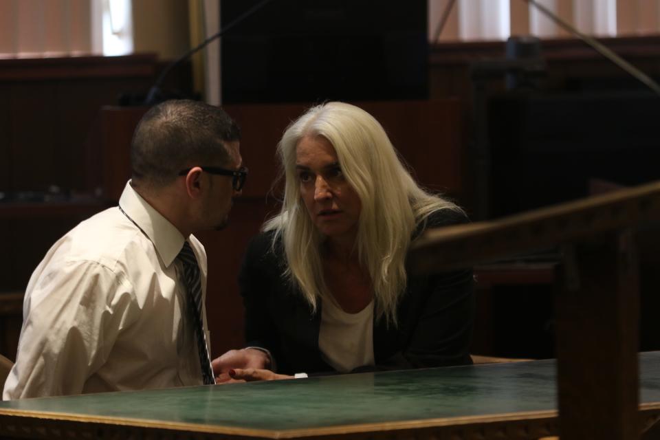 Defense attorney Lisa Torraco (right) discusses evidence with her client Manuel Sanchez during his murder trial, Oct. 23, 2023.