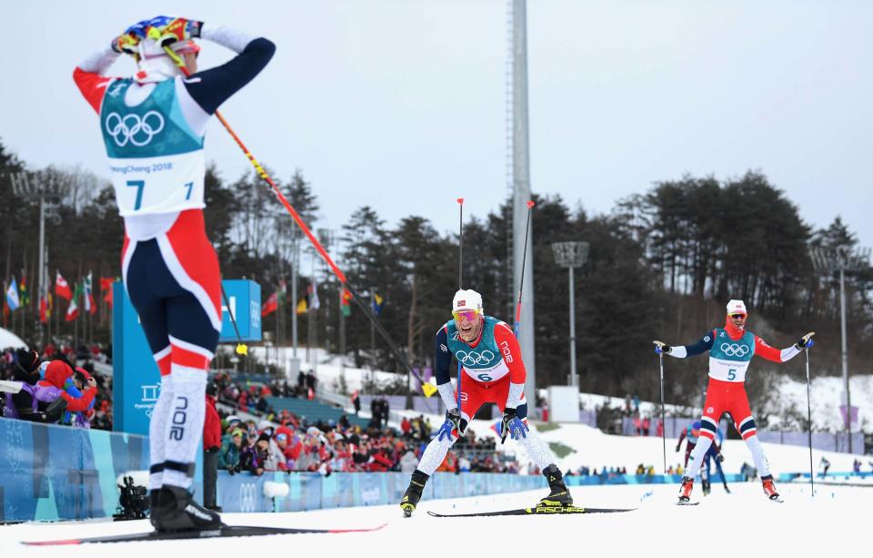 Simen Hegstad Krüger waits for Norway teammates Martin Johnsrud Sundby and Hans Christer Holund at the finish line. (Getty)