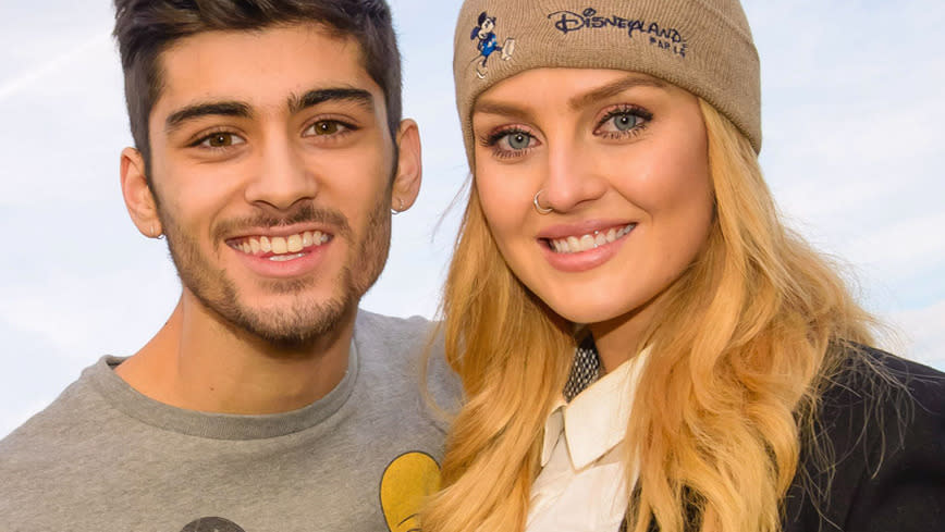 Zayn (L) and Perrie visit Disneyland in January last year. Photo: Splash News