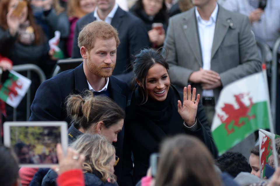 Meghan pulled her hair up in another messy bun. Source: Getty