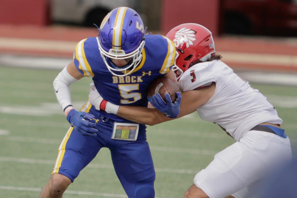 Jim Ned's Colt Lindsey wraps up Brock receiver Diego Hernandez in the regional semifinals.