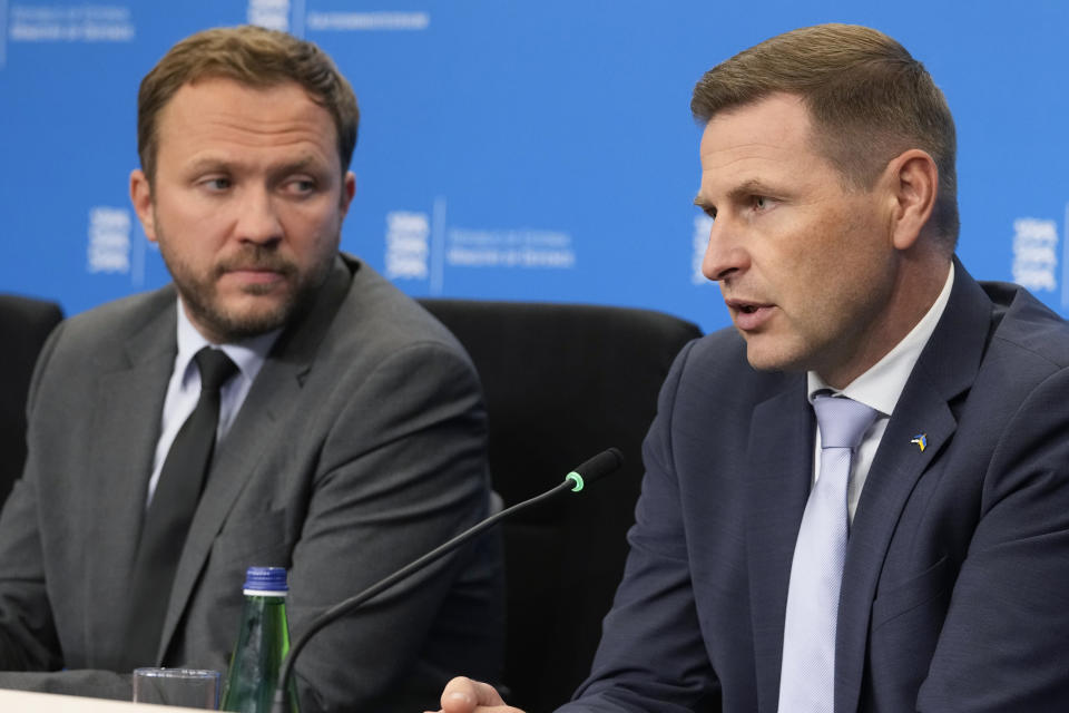 Estonia's Foreign Minister Margus Tsahkna, left, and Estonia's Defence Minister Hanno Pevkur attend a news conference in Tallinn, Estonia, Tuesday, Oct. 10, 2023. Finland and Estonia say the undersea Balticconnector gas pipeline running between the two countries across the Baltic Sea has been temporarily taken out of service due to a suspected leak. Finnish President Sauli Niinisto says damage to an undersea gas pipeline and telecommunications cable connecting Finland and Estonia appears to have been caused by "external activity." (AP Photo/Sergei Grits)