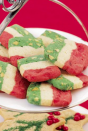 <p>What says Christmas more than a red, white, and green batch of cookies? These ice box cookies are delicious and are a little more creative than your standard Christmas cookies. </p><p><em><a href="https://www.womansday.com/food-recipes/food-drinks/recipes/a16335/spumoni-icebox-cookies-2526/" rel="nofollow noopener" target="_blank" data-ylk="slk:Get the recipe;elm:context_link;itc:0;sec:content-canvas" class="link ">Get the recipe</a>.</em> </p>