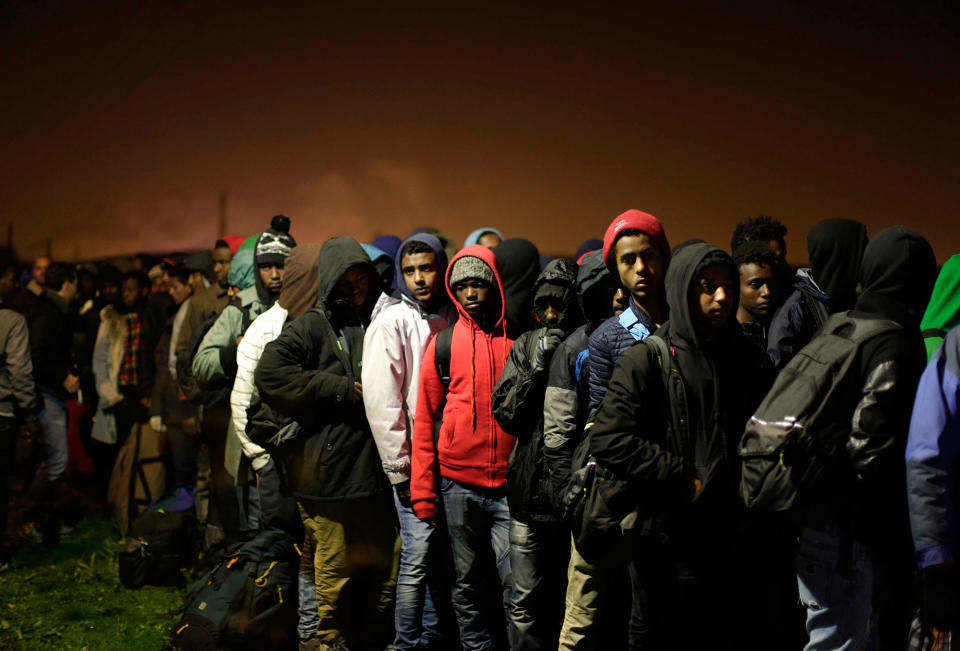 Migrants prepare to evacuate “the jungle,” in Calais, France