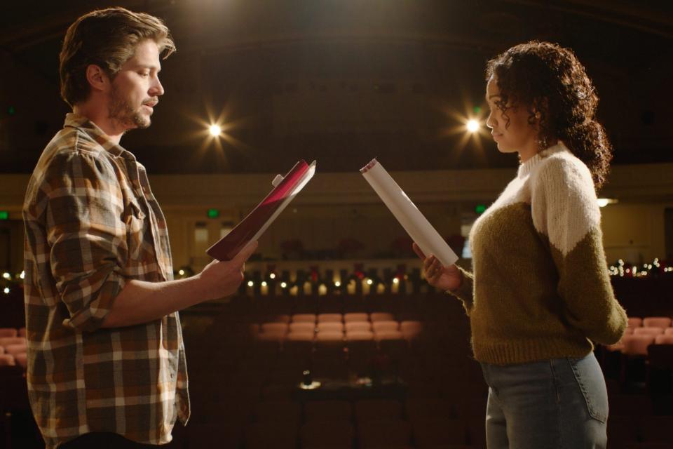 Thomas McDonell and Jamie Perez in a scene from "A Show-Stopping Christmas," airing on Lifetime. Norwell teenager Anna Ruffini sings a song featured in the movie.