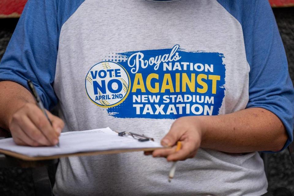 A customer wearing a “Vote No” shirt Monday at The Brick. The election on the stadium tax is April 2.